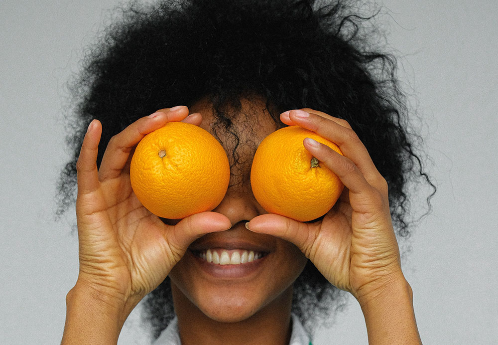holding oranges eyes